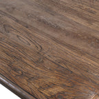 Detailed shot of the Reclaimed Elm Dining Table's reclaimed wood surface, emphasising sustainability