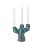 Blue candle holder used for cozy home d√©cor