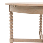 Base detail of Wallingford Round Extending Dining Table displaying the craftsmanship of the pedestal design and supportive feet