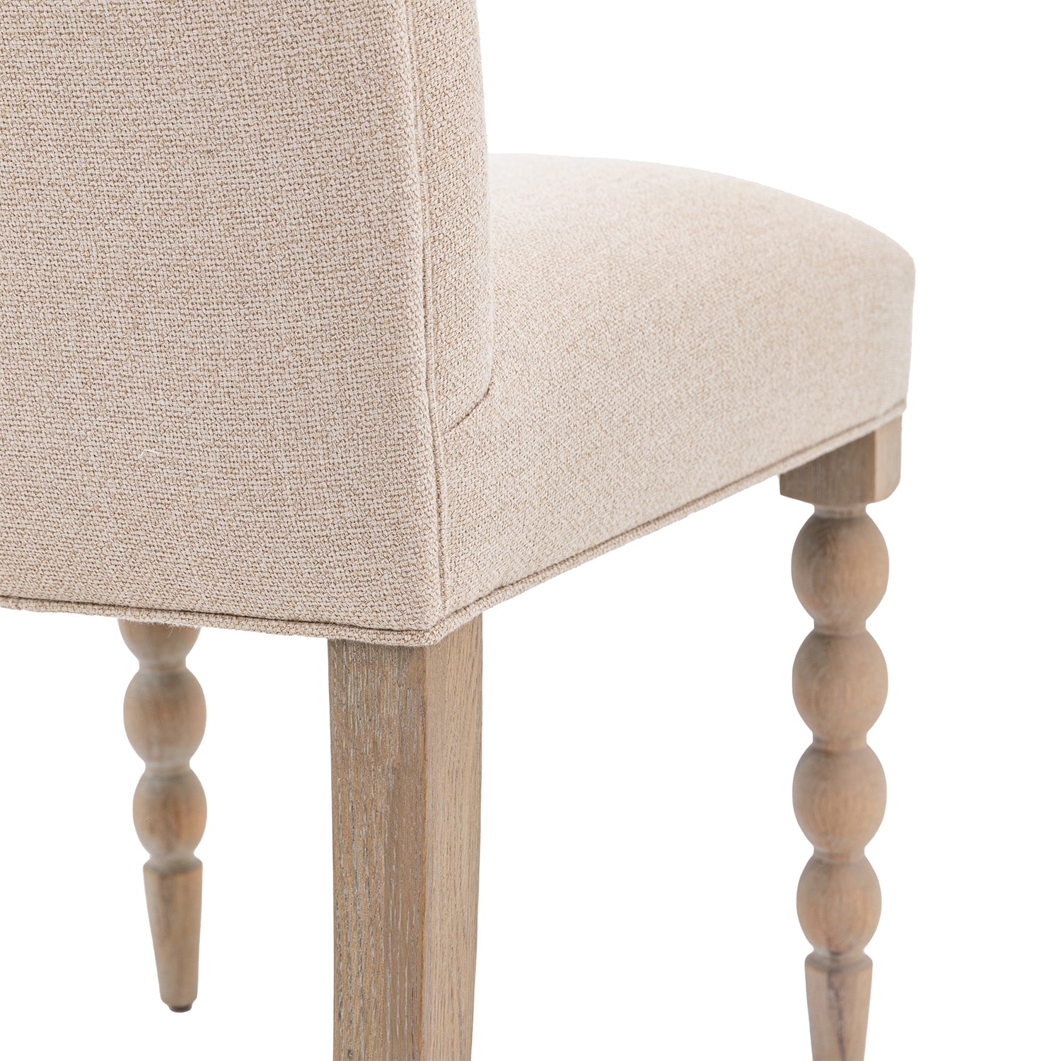 Detail shot of the Wallingford Dining Chair's leg design, showing the craftsmanship and structural elements that provide stability.