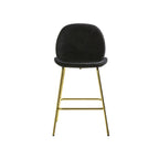A black velvet barstool with a brass base.