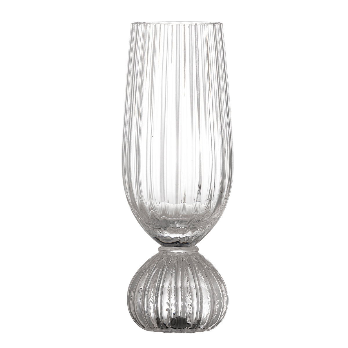 Clear champagne glass with ribbed design on a white background