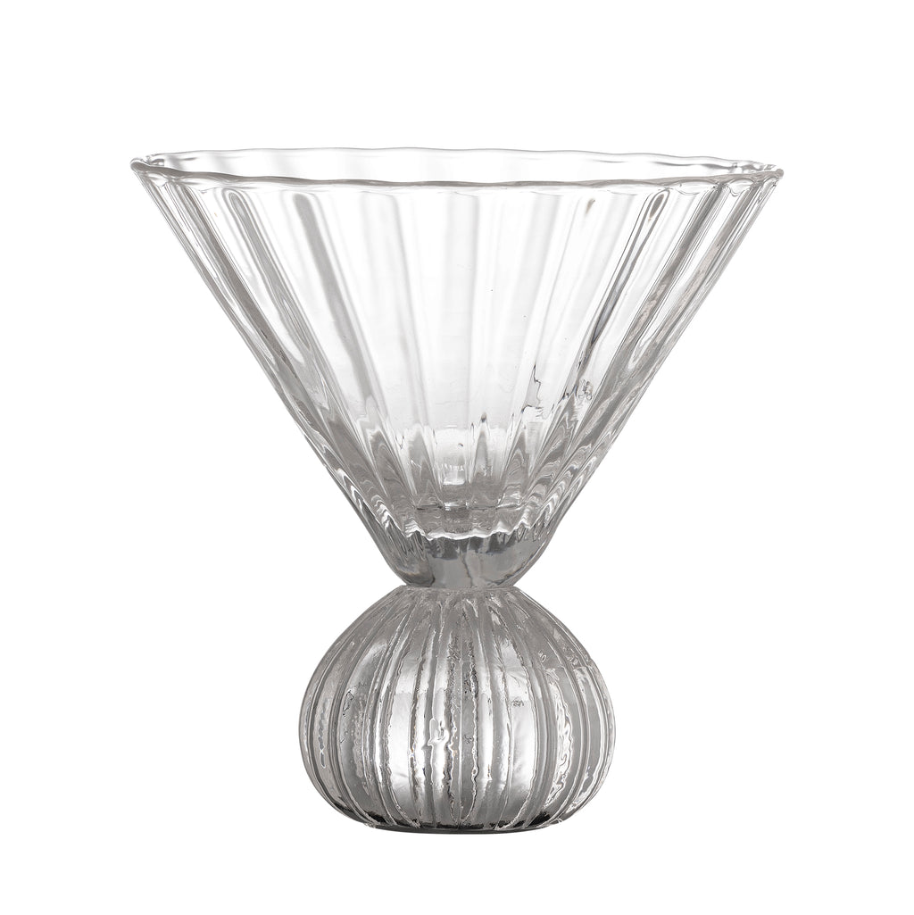 Clear glass martini glass with ribbed design on a white background