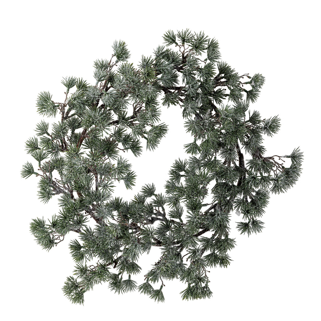 Artificial pine wreath on a white background