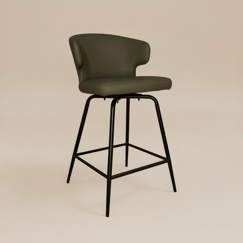Green bar stool with black metal legs on a white background