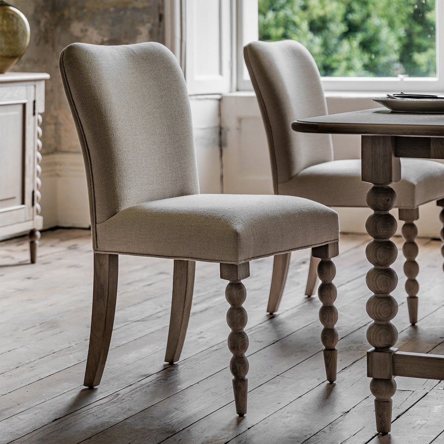 Wallingford Dining Chairs arranged at a dining table, demonstrating how they look when grouped together in a complete dining setting
