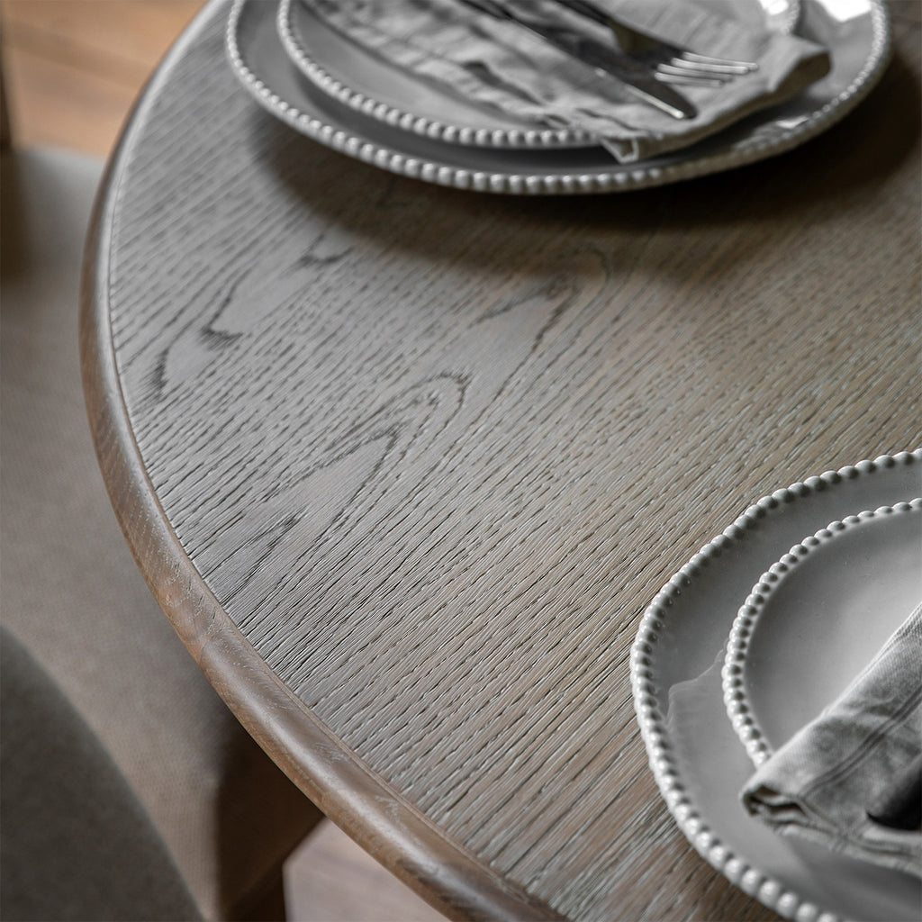 Overhead view of Wallingford Round Extending Dining Table's wooden top, revealing the natural grain patterns and smooth finish of the dining surface