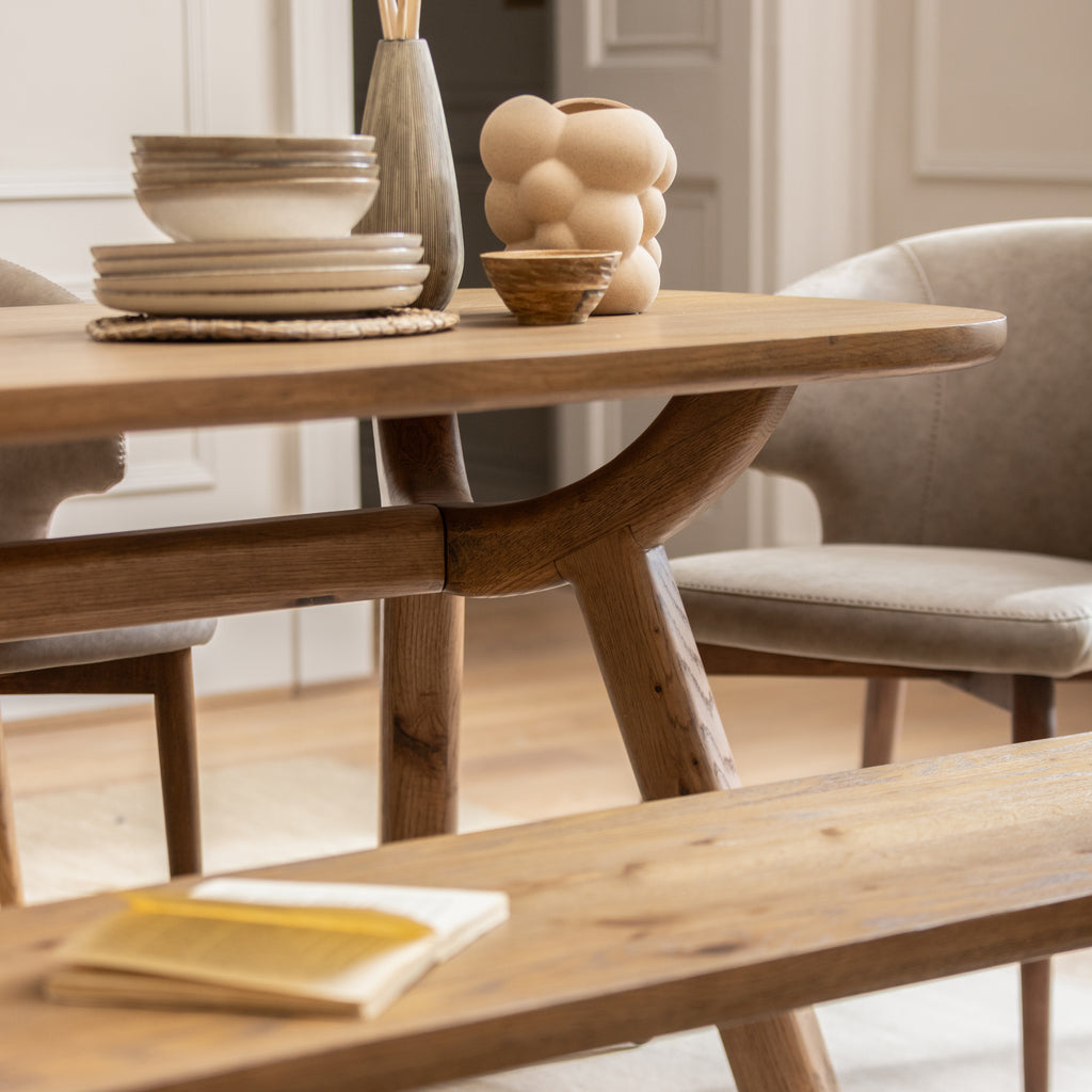 Solid white oak wood dining table with an oval top. Matching dining benches now online.