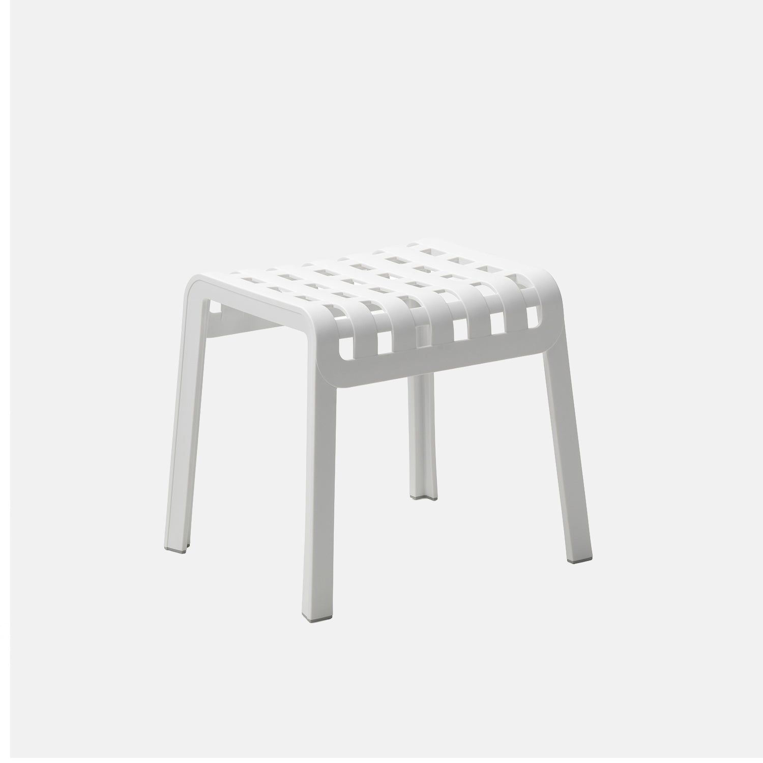 White stool with a grid pattern on a light grey background
