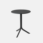 Black round Spritz table with three legs on a white background