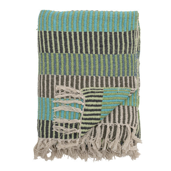 Woven blue blanket with striped pattern and fringes on a white background