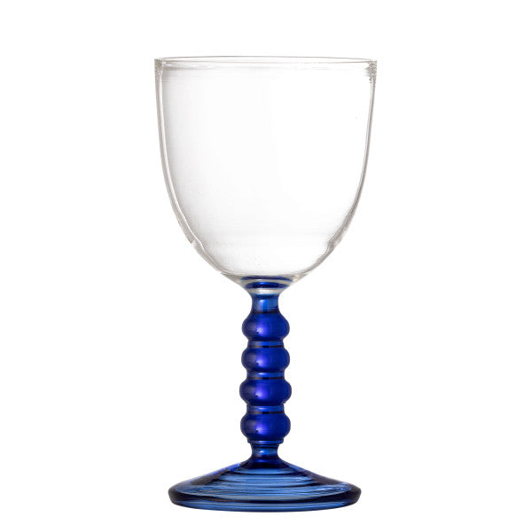 Clear wine glass with a blue stem on a white background