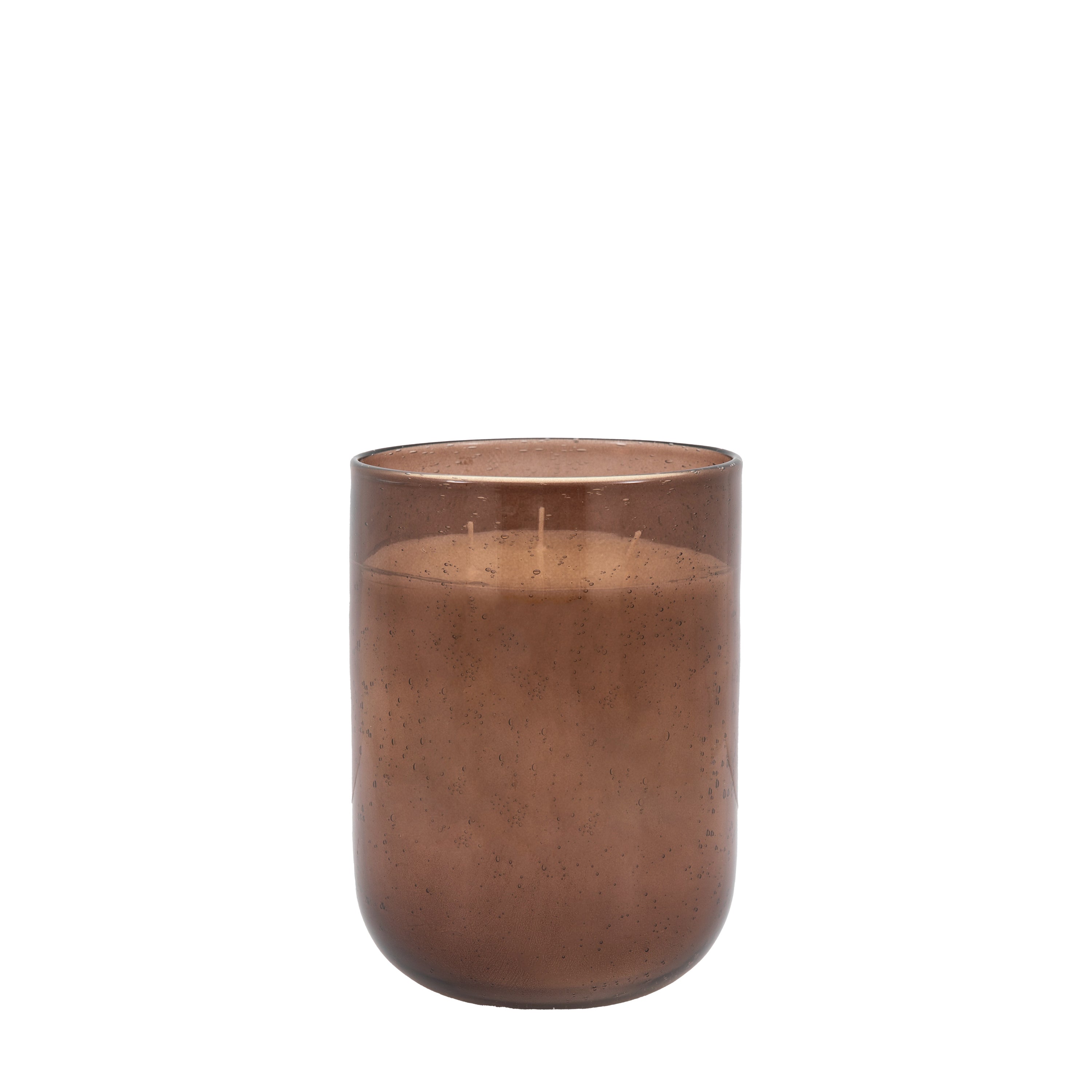 Tall large brown candle placed in living room setting
