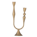 Brass candle holders arranged for table d√©cor