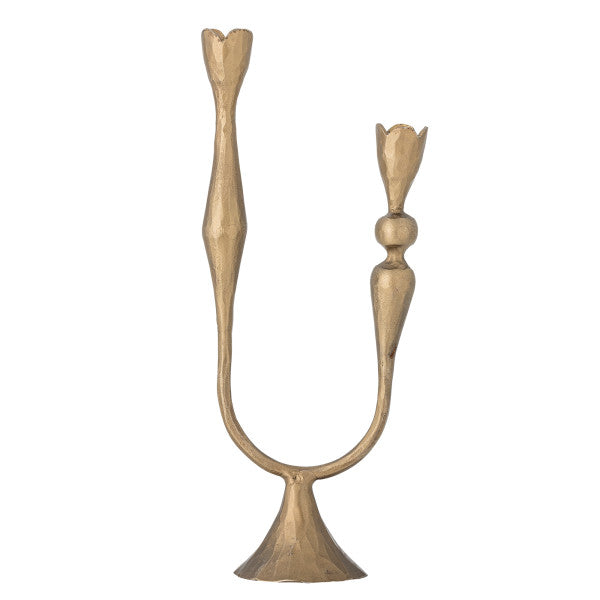 Brass candle holders arranged for table décor