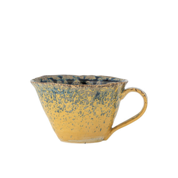 Modern blue and yellow cup ideal for coffee, tea, or display.