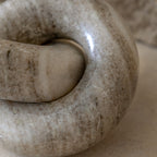 Close-up of marble texture on decorative link
