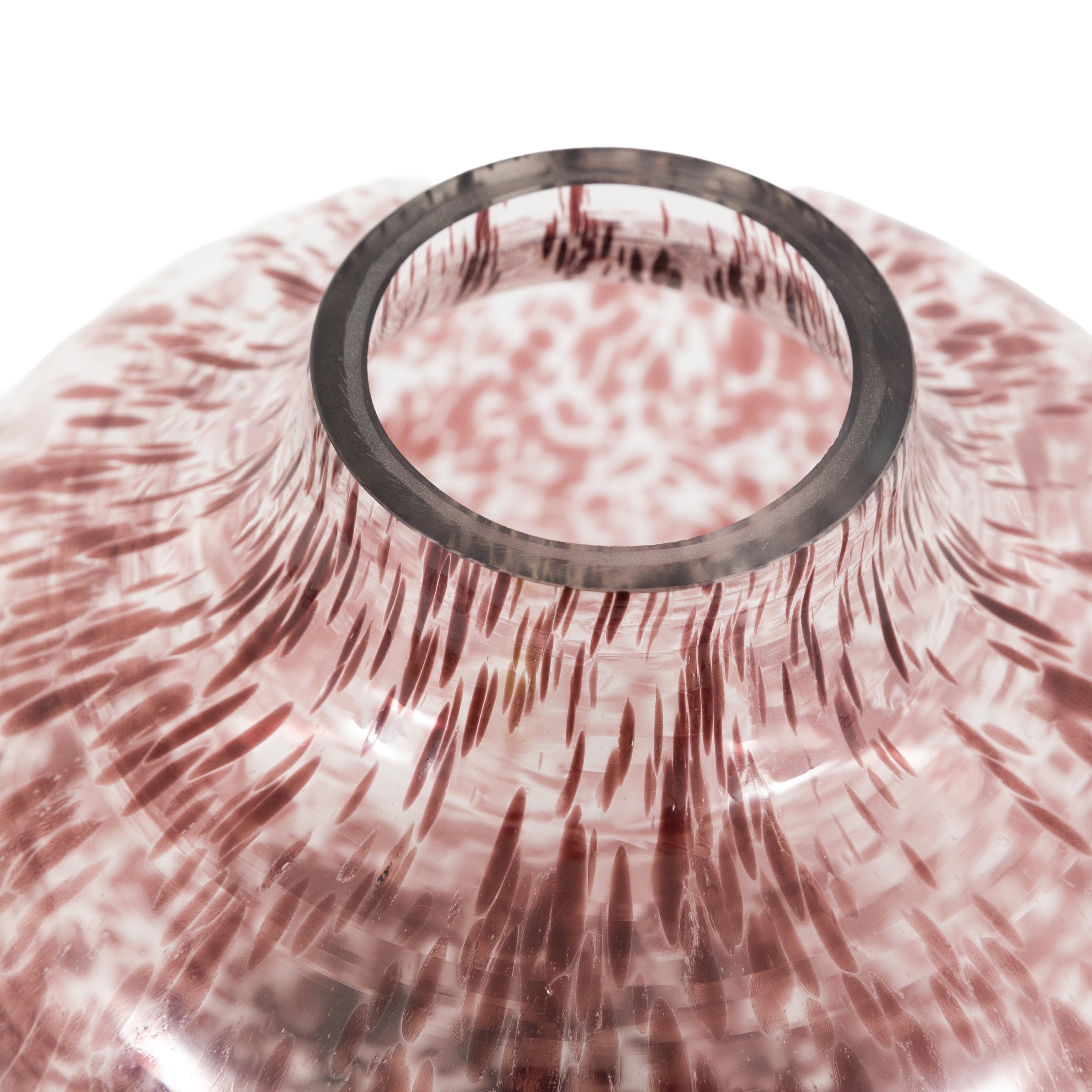 Close-up of a pink and white patterned vase with a metallic ring