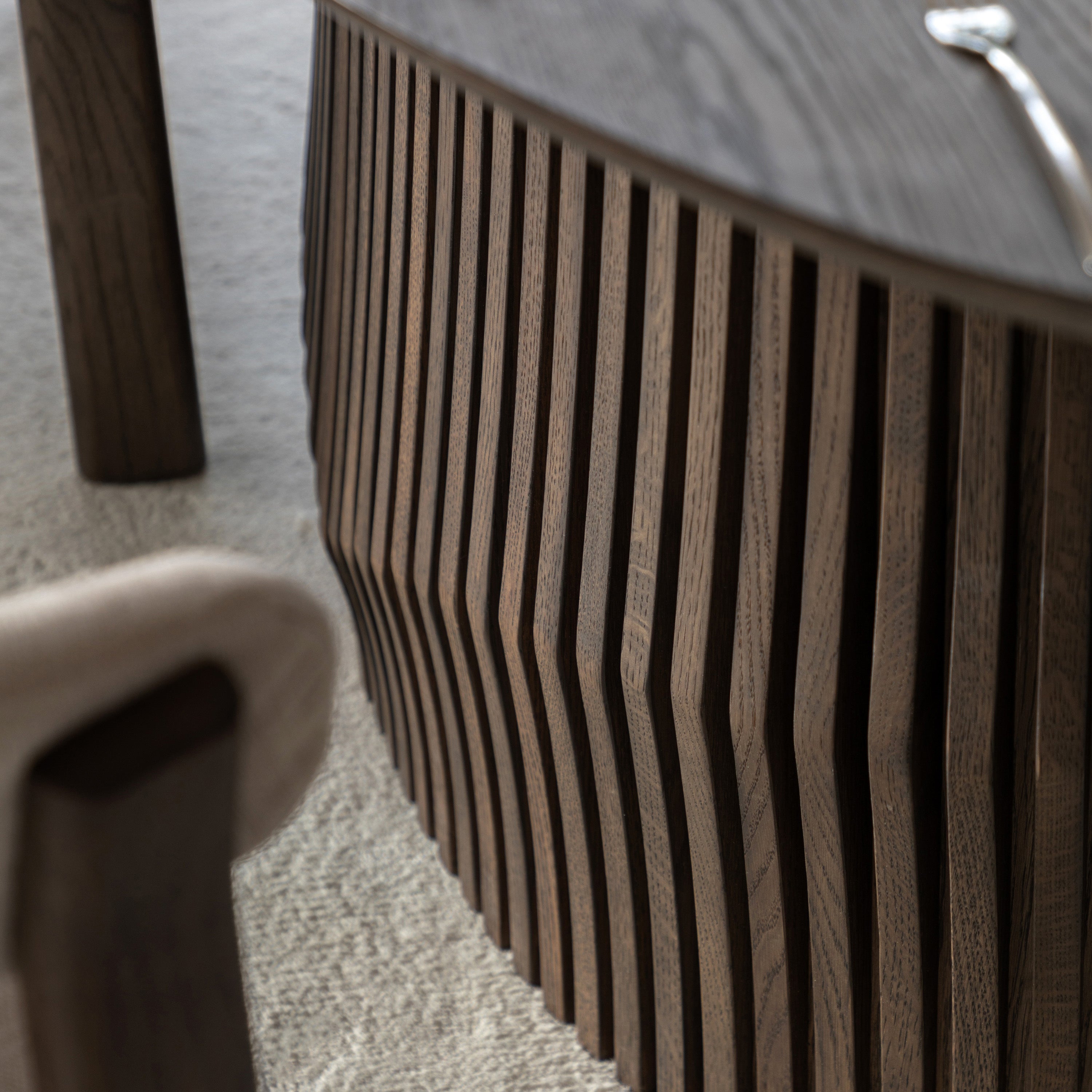 Walnut Dining Table with a textured surface on a light-coloured floor.