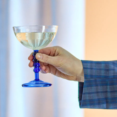 Elegant blue cocktail glass used for serving drinks