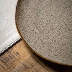 Elegant white oatmeal dinner plate styled for modern dining