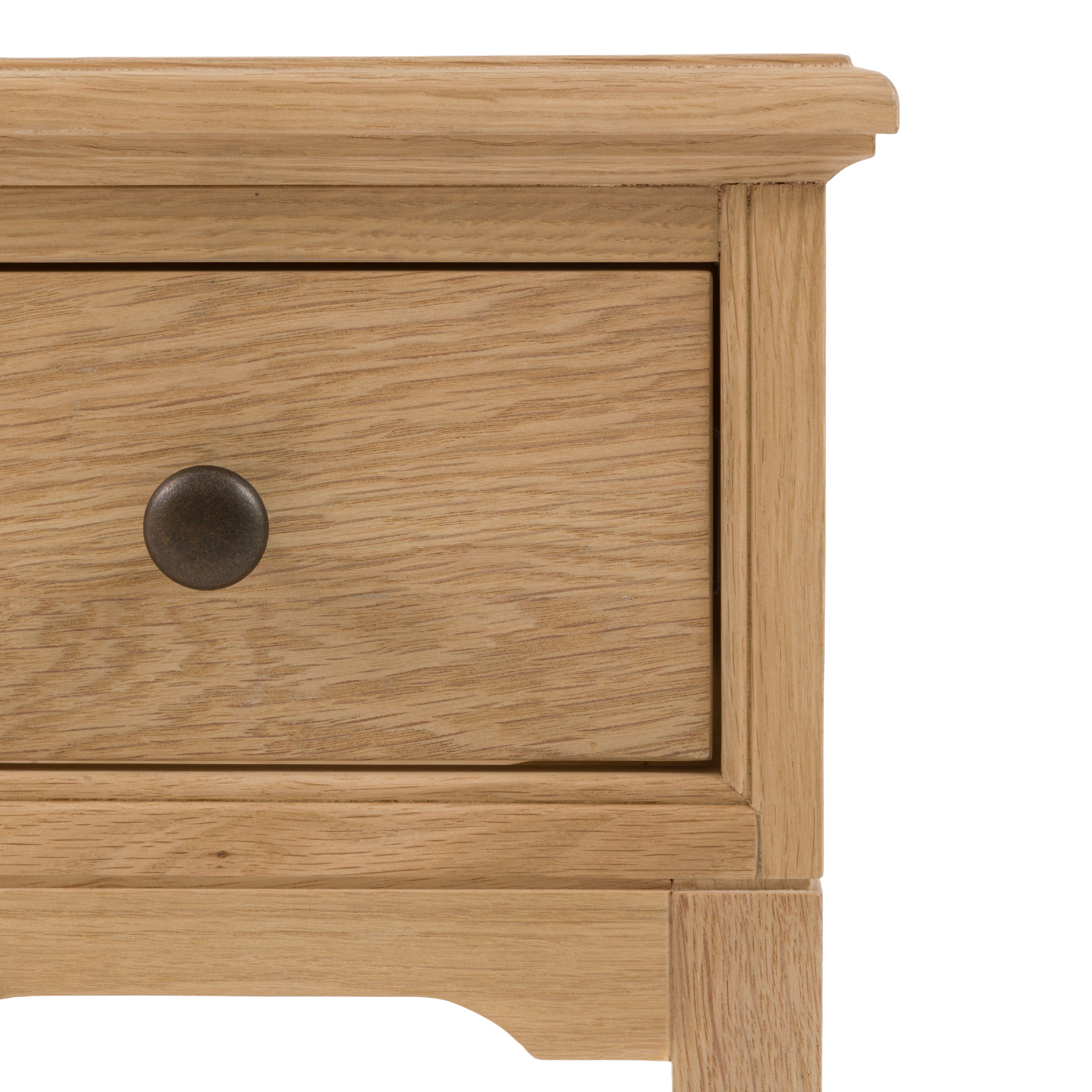 Detailed photo of an oak drawer with a knob on a white background, from a 1 drawer bed side table.