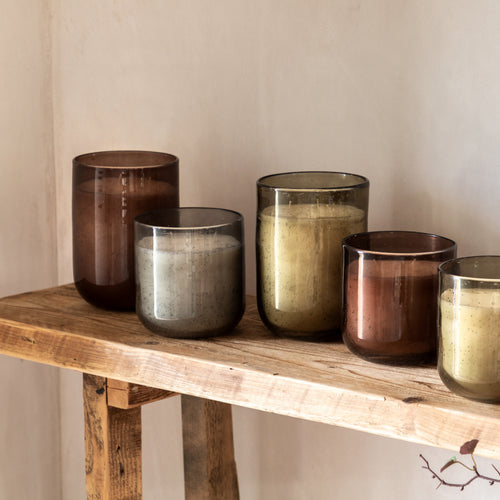 Inviting spaces with soft lighting and natural earthy tones.
