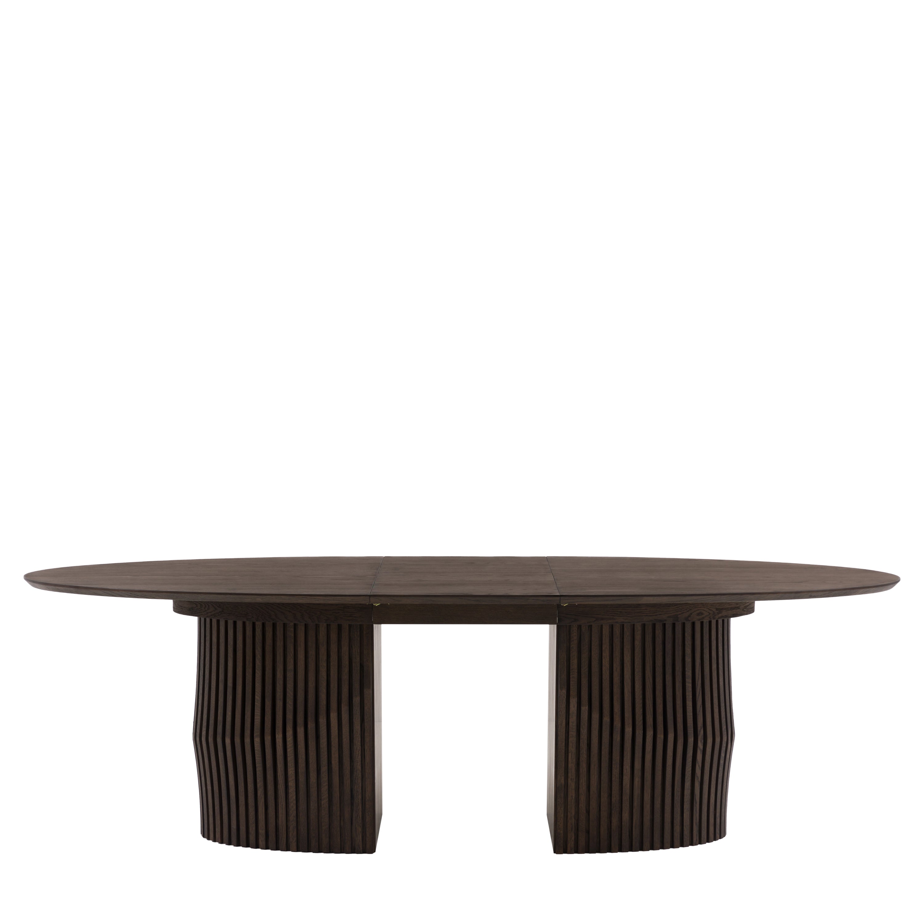 Oval dining table extended with guests seating arrangement