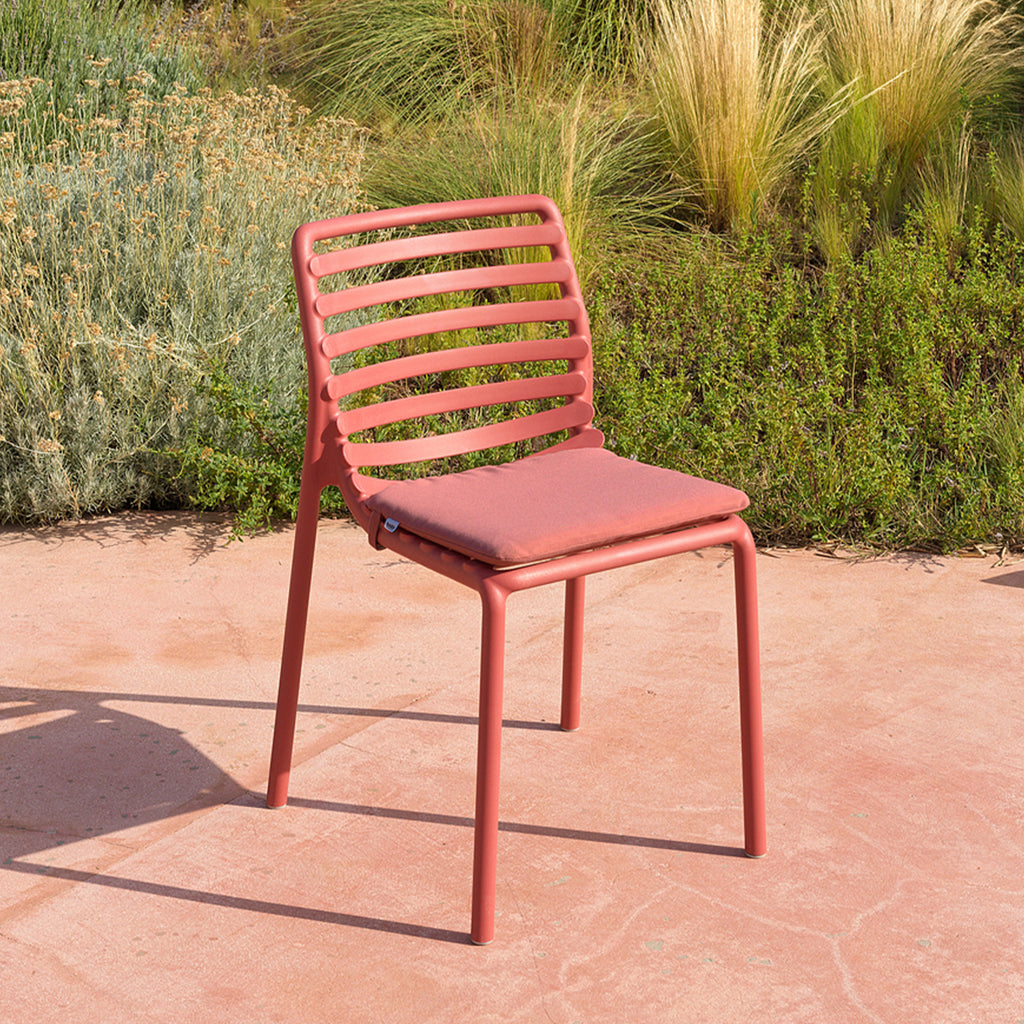 Doga Bistro Cushion in a vibrant outdoor seating area.