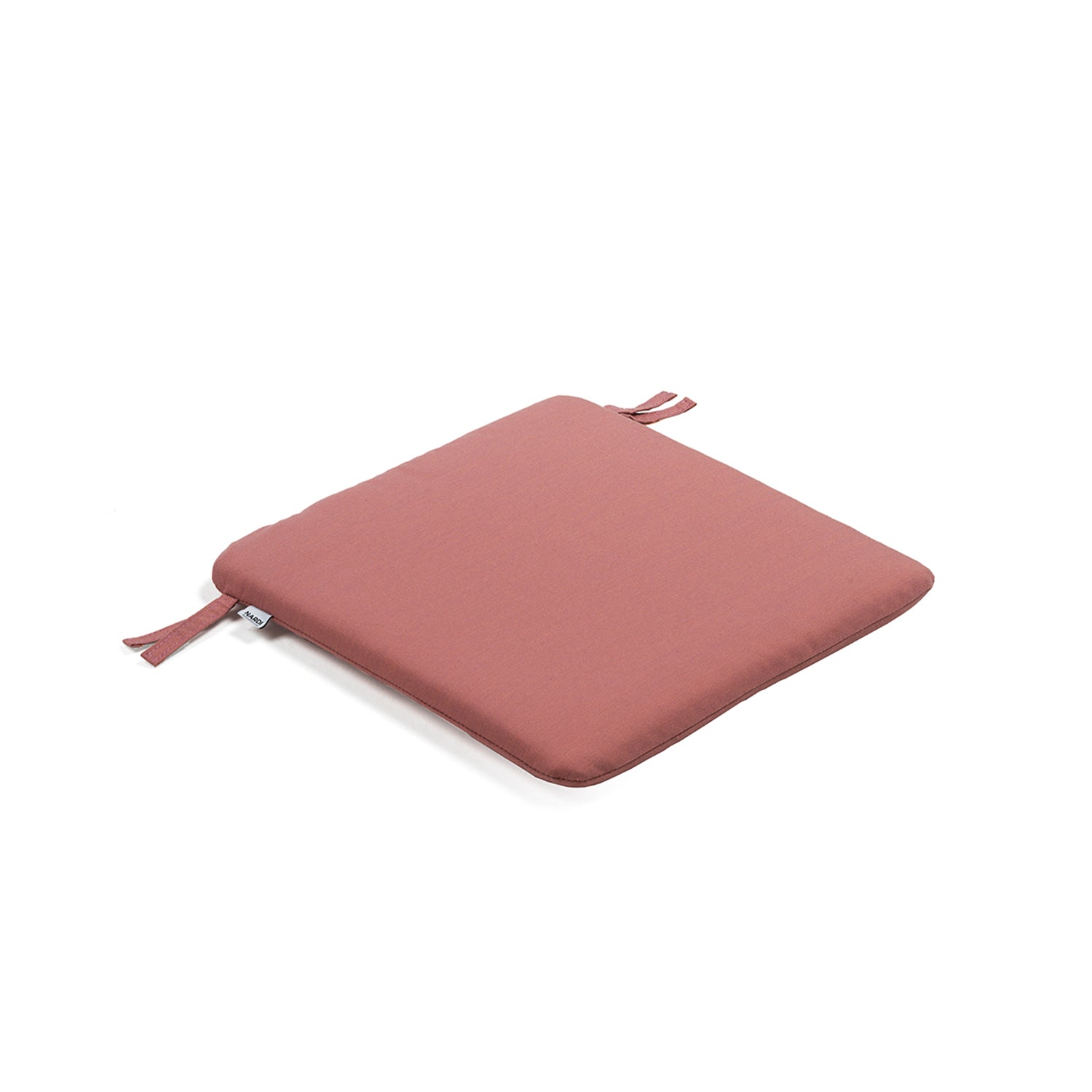 Elegant Doga Bistro Cushion enhancing a patio dining area.