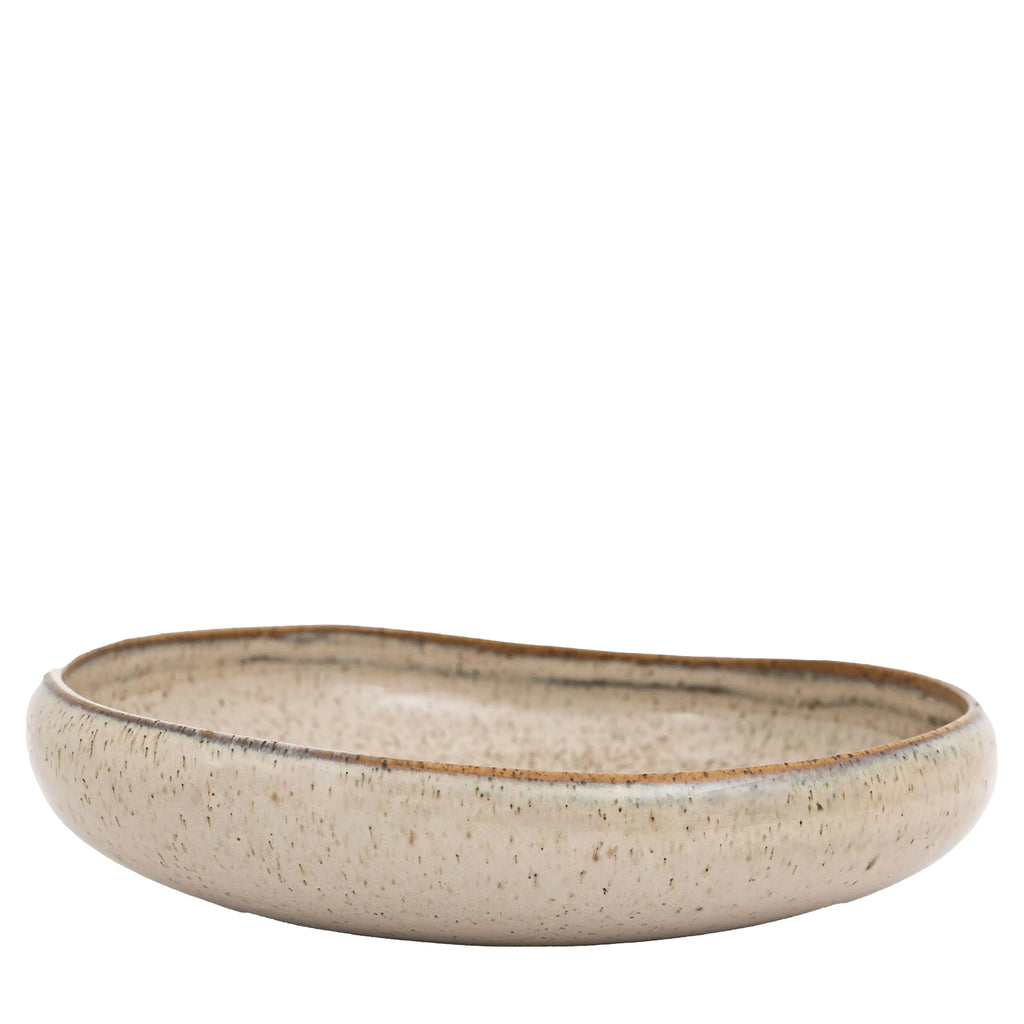 White oatmeal bowl styled in contemporary kitchen setting
