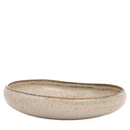 White oatmeal bowl styled in contemporary kitchen setting