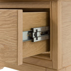 Wooden bedside drawer with metal handle and latch
