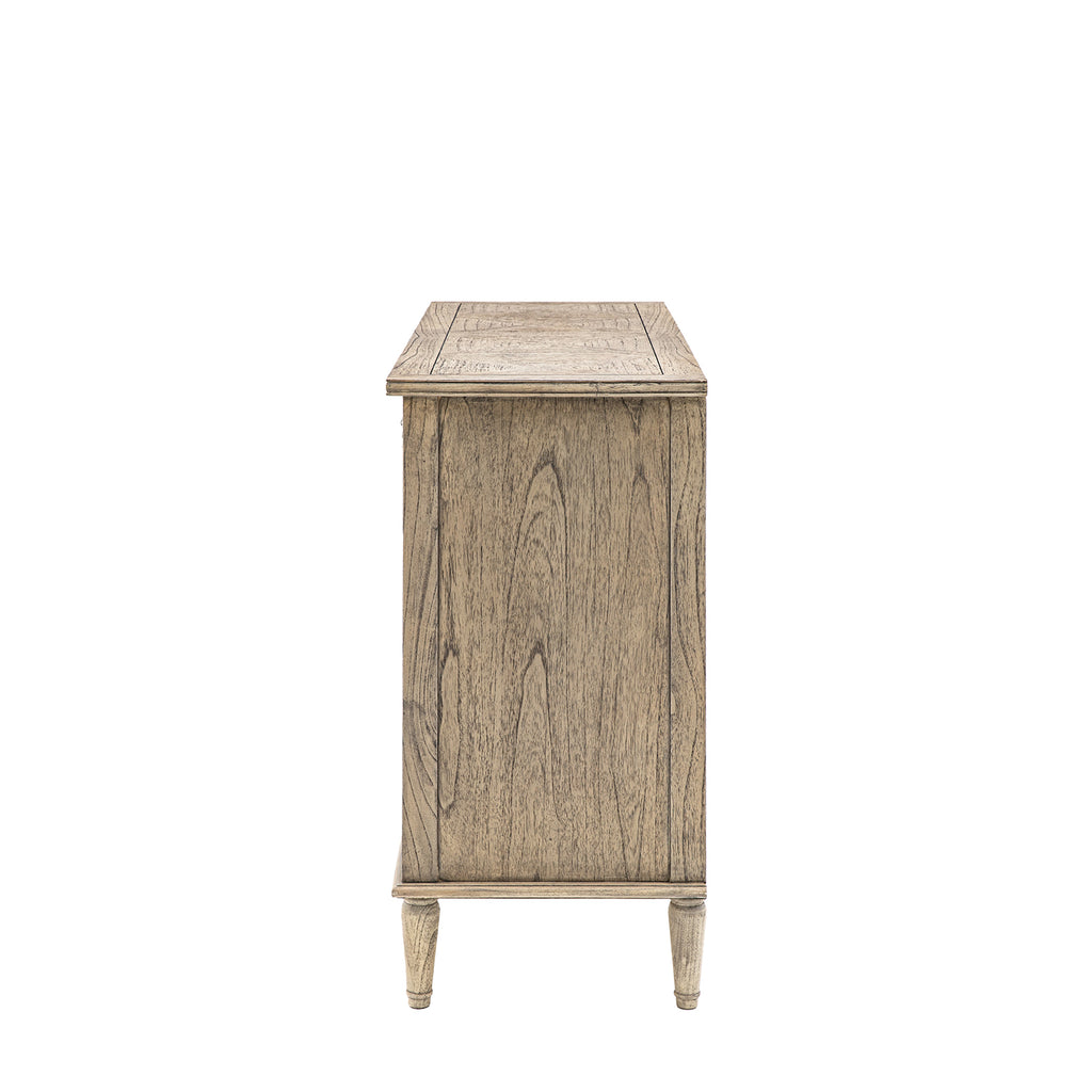 Side angle of Faringdon 7 Drawer Chest showcasing its height, proportions, and the detailed craftsmanship of the turned feet and frame