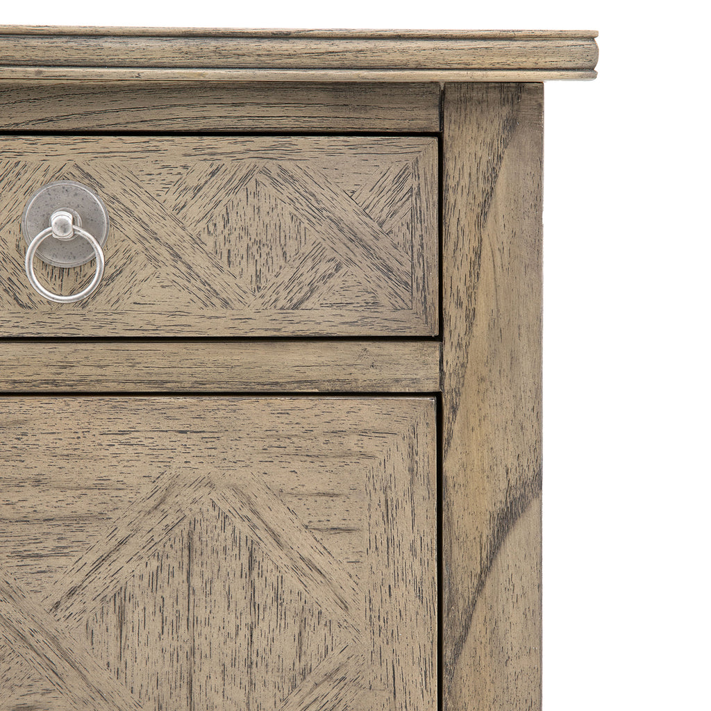 Close-up detail of Faringdon Chest's parquet wood pattern, highlighting the natural grain variations and inlaid design craftsmanship
