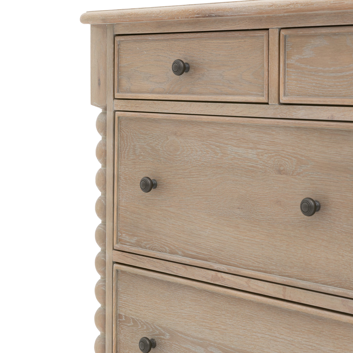 Wooden dresser with four drawers and metal knobs on a white background