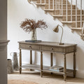 Faringdon Console Table in a styled entryway setting with decorative items, demonstrating its use as a display surface and storage solution.