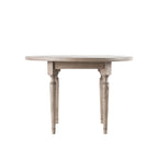 Faringdon Round Dining Table with elegant parquet wood top design, featuring sturdy turned legs and natural wood finish, perfect for family dining spaces.