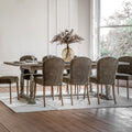 Faringdon Extending Dining Table in a styled dining room setting with chairs, demonstrating its proportions and how it fits in a complete dining arrangement.