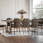 Faringdon Extending Dining Table in a styled dining room setting with chairs, demonstrating its proportions and how it fits in a complete dining arrangement.