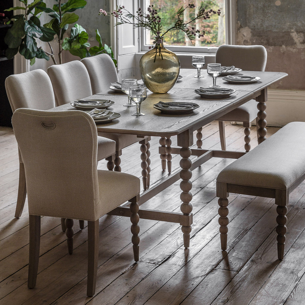 Wallingford Extending Dining Table in a styled dining room setting with chairs, demonstrating its proportions and how it fits in a complete dining arrangement