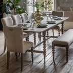 Wallingford Extending Dining Table in a styled dining room setting with chairs, demonstrating its proportions and how it fits in a complete dining arrangement