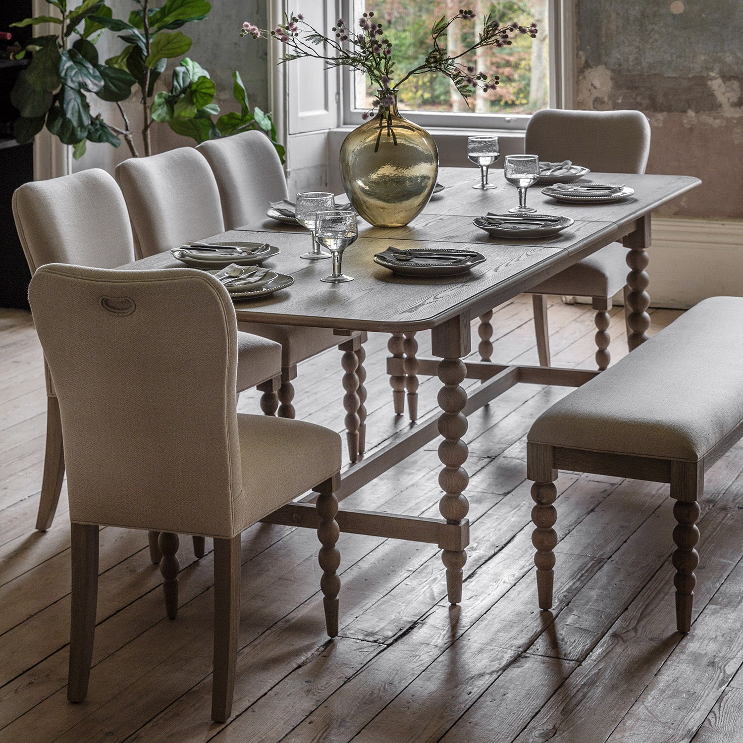 Wallingford Extending Dining Table in a styled dining room setting with chairs, demonstrating its proportions and how it fits in a complete dining arrangement