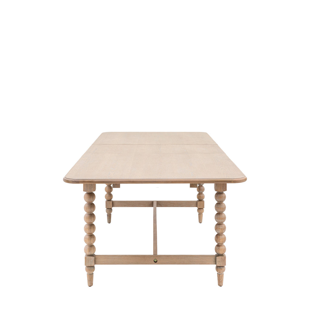 Side view of Wallingford Extending Dining Table showcasing the solid wooden legs and frame construction, highlighting its stability and craftsmanship