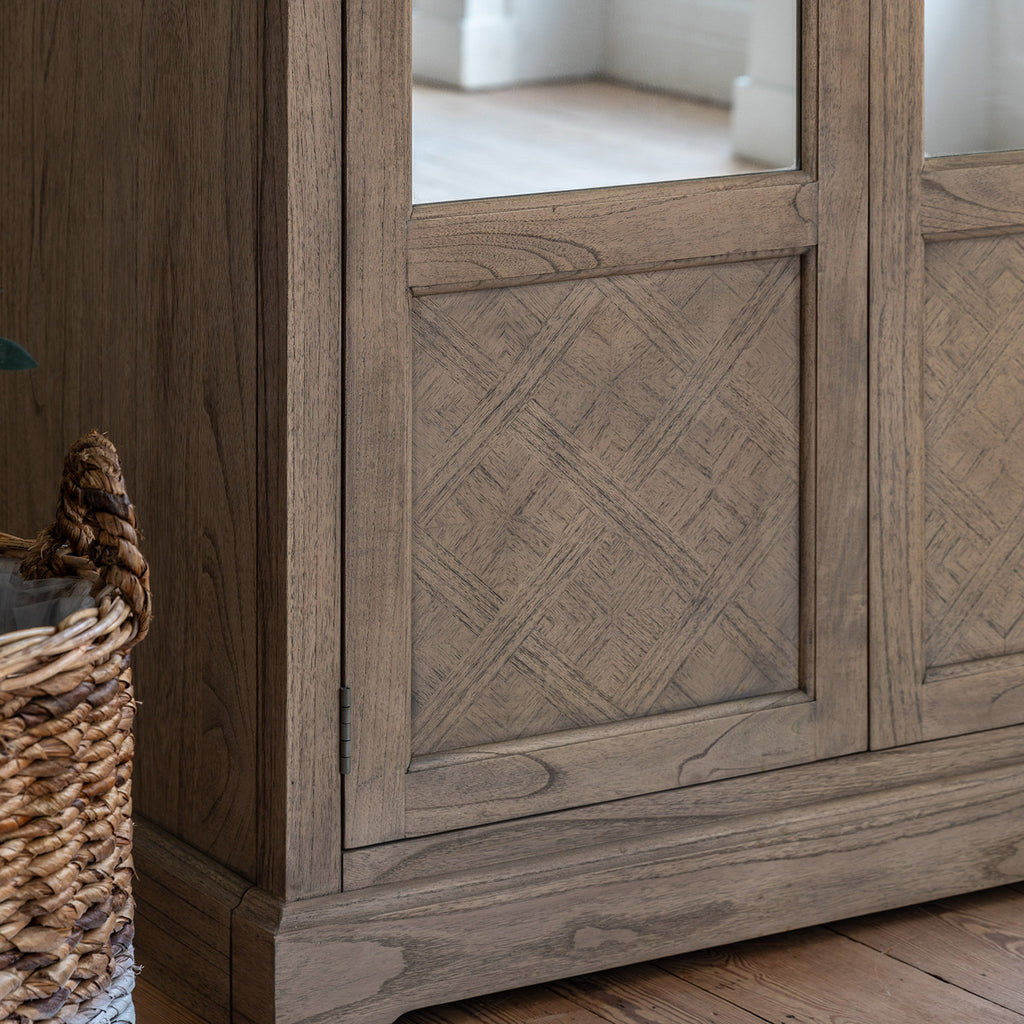 Close-up detail of Faringdon Wardrobe's parquet wood pattern and craftsmanship, highlighting the natural grain variations and quality construction.