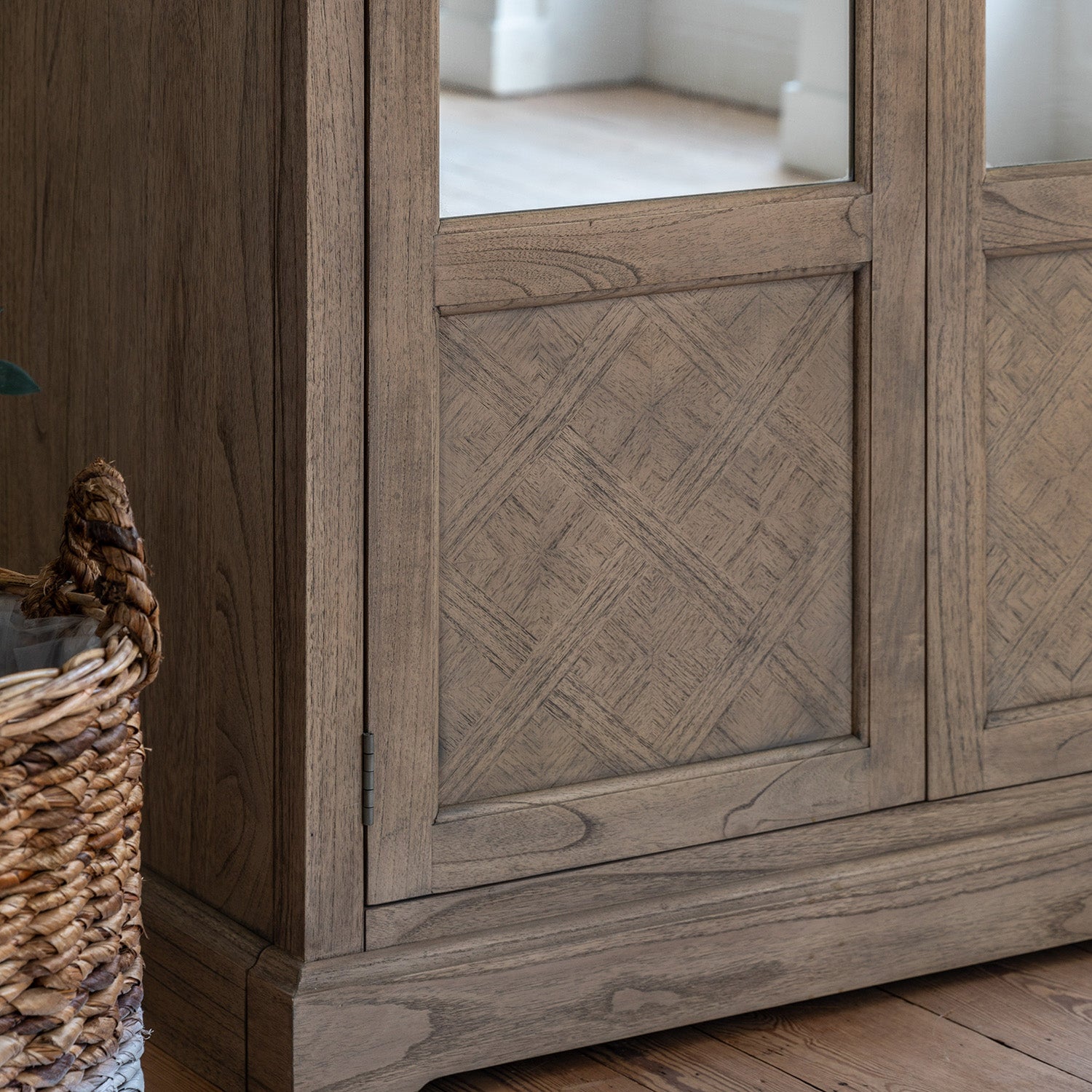 Close-up detail of Faringdon Wardrobe's parquet wood pattern and craftsmanship, highlighting the natural grain variations and quality construction.