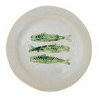 Round ceramic fish plate with green coastal design on white background