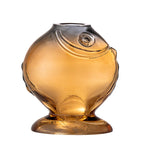 lose-up of yellow fish vase showing sculpted features