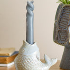Decorative fish candle holder placed on a table