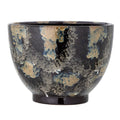 Ceramic pot with blue glaze on a white background